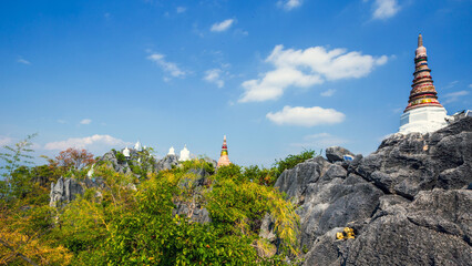 Landscape view of pagoda on the top peak of mountain at Wat Chalermprakiet, Lampang province, Thailand, Asia.