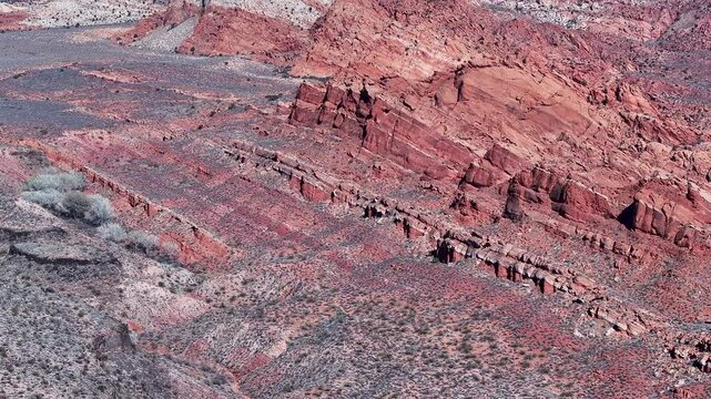 Aerial red rock mountain landscape southern Utah 1 4K. Southwestern desert St George. Geological landscape wind, weather and water carved erosion, spectacular beautiful mountain valley. River.