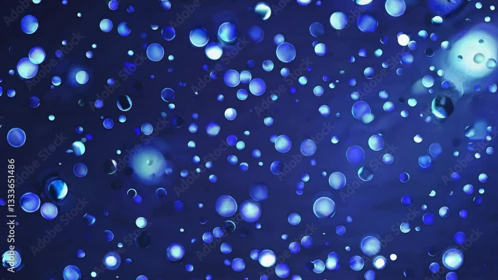 Poster seamless loop abstract blue bubble background with varying sizes of droplets in a dreamy atmosphere,