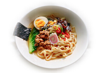 A bowl of Ramen Noodle with chicken egg vegetables mushroom in white background