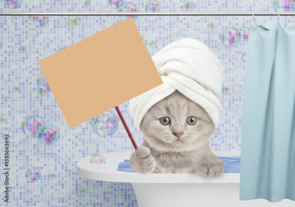 Aufkleber Cute kitten with towel on it head takes the bath at home with rubber duck and showing blank placard. Empty space for text