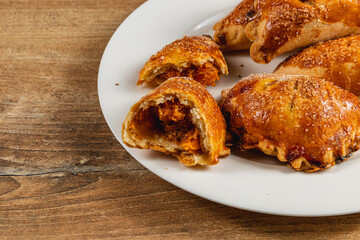 Enjoying pumpkin-filled pastries on a rustic wooden table