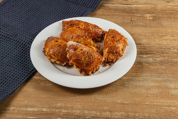 Deliciously baked pumpkin pastries on a white plate served on a wooden surface