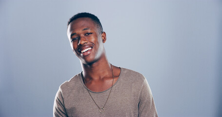 Smile, creative and portrait of black man in studio with mockup space, confidence or university registration. Opportunity, ID card or gen z student in college candidate recruitment on gray background