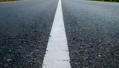 Fototapeta premium Low Angle View of White Road Dividing Line on Paved Highway