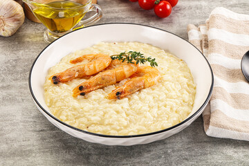 Italian risotto with prawn served thyme