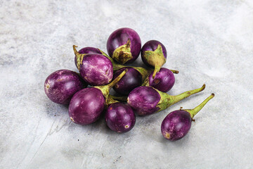 Small organic young purple round eggplant