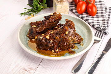 Prepared tasty beef ribs with sauce