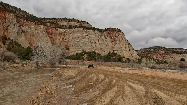 Utah desert trail off road recreation river crossing POV 2 4K. Recreation off road, nature exploring. Desert mountain canyon valley trail ride area. Rocky, forest, desert hill, river crossings.