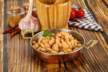 Baked white canned beans in the bowl