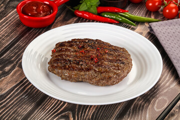 Grilled beef burger cutlet with sauce