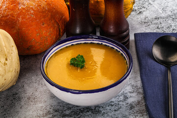 Vegan pumpkin cream soup served sesam