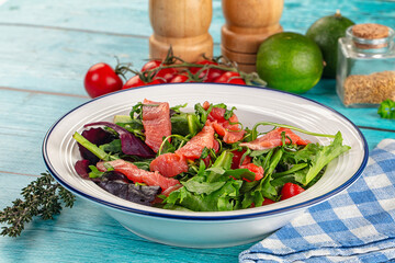 Salad with salmon and arugula