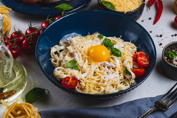 Pasta carbonara in a plate on the table