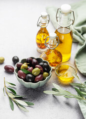 Assorted olives and olive oil on rustic table