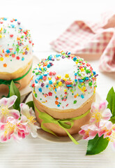 Traditional easter cakes decorated with colorful sprinkles and spring flowers