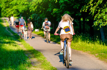 Fototapeta premium Cyclist ride on the bike path in the city Park