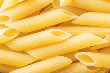 Penne rigate made from wheat flour. Macro shot