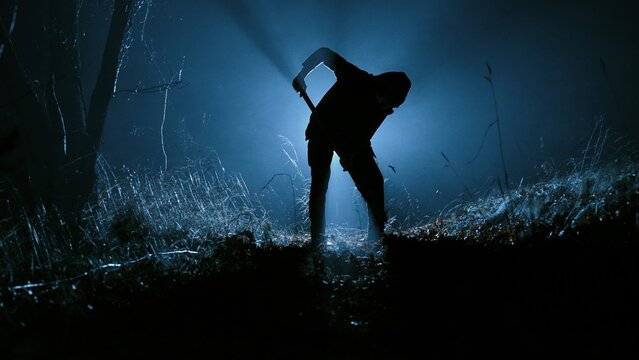 Mysterious Figure Digging in the Dark