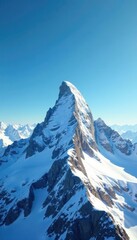 Fototapeta premium Snow capped peak stretches towards clear blue sky, serene and untouched, icy, mountain