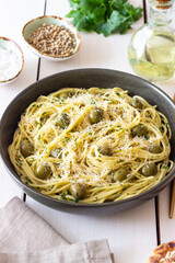 Pasta spaghetti with olives, herbs and cheese. Healthy food. Italian cuisine. Vegetarian food.