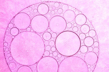 Macro bubble texture pink,Abstract pink oil bubbles background. Cosmetic liquid beauty product.
