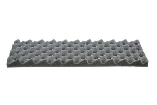 Isolated on a white background, this gray acoustic foam panel features an egg crate pattern for soundproofing.