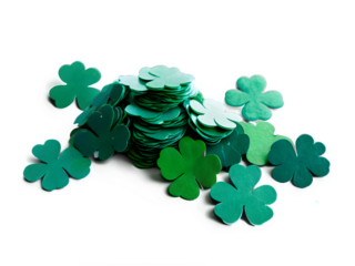 Scattered shamrock-shaped confetti pieces in various shades of green, spread across a bright white surface.
