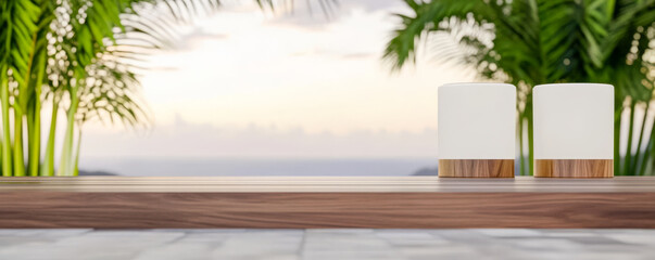Elegant candle holders on a wooden table with ocean view during sunset