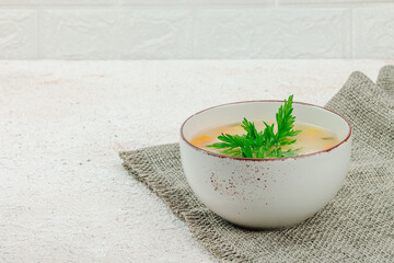 Hearty homemade Italian wedding soup with greens and meatballs