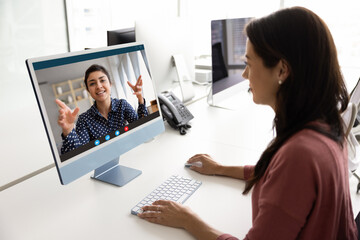 Latin business woman talking to female Indian online teacher, colleague, project manager, boss on...