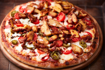 Gyros Pizza with jalapeno pepper, cherry tomatoes and mozzarella cheese. Soft focus. Close up.	