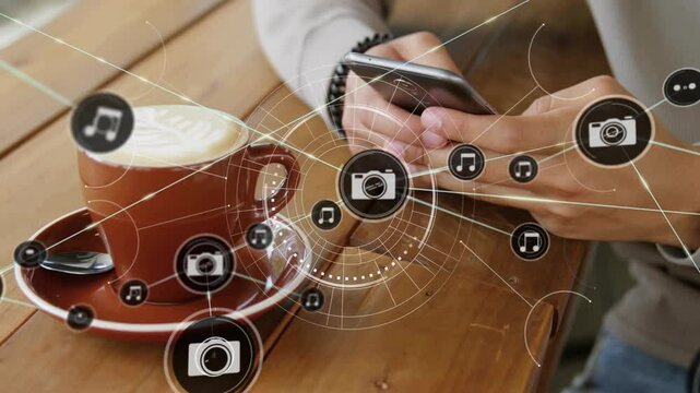 Using smartphone with animation digital icons, person having coffee on table