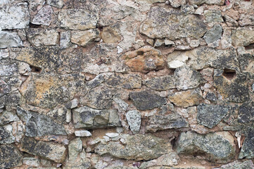 stone wall of an old building close up
