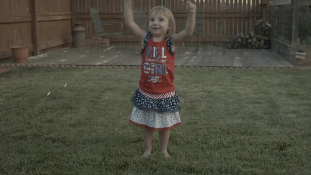 Cute Little Girl Playing with Sparklers and then Gets Sad when they Burn out