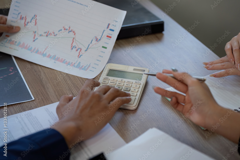 Aufkleber finance and analysis. a close-up of hands analyzing financial documents and using a calculator to as