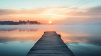 Fototapeta premium Serene Sunrise over Misty Lake: A Wooden Dock Beckons