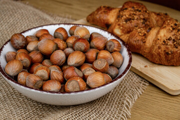 Nuts closeup.Hazelnuts.Healthy food.Healthy organic nuts in a plate on the table