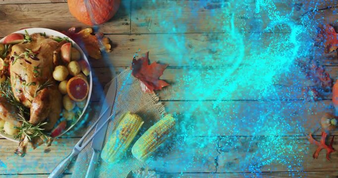 Thanksgiving meal with corn and leaves on wooden table, blue light animation overlay