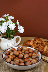 Croissants and hazelnuts on the table. Delicious healthy breakfast. Top view
