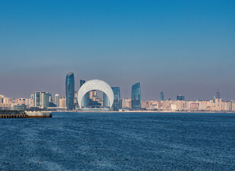 Baku, Azerbaijan. View of the business center "The Crescent Bay" and "Port Baku" from the embankment of the Baku Bay. Baku boulevard.