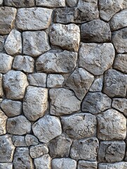 Fototapeta premium Textured seamless stone wall made of many irregularly shaped rocks