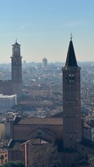High panoramic view of Bergamo city with buildings, sunlight and scenery 