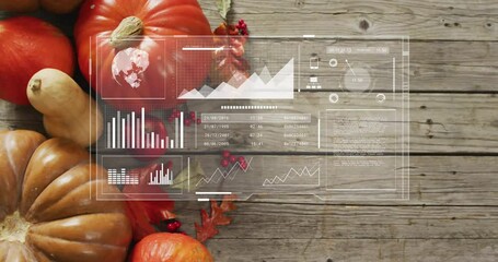 Data analytics animation overlaying pumpkins and autumn leaves on wooden background - Powered by Adobe