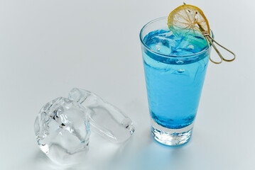 fresh blue cocktail with ice on a white background