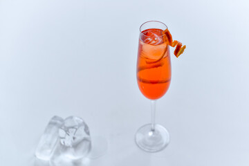 orange cocktail in a tall glass