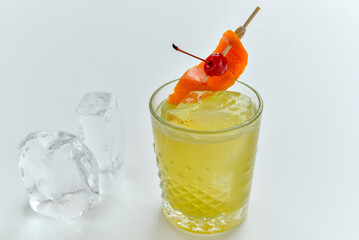 fresh yellow cocktail with ice on a white background