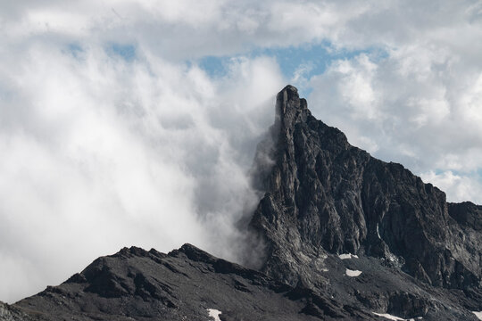 Pillar of Stone Above the Clouds - Powered by Adobe