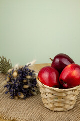 Red beautiful apples in a basket on the table. Red apples. Apple diet