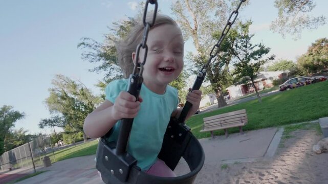 Little Toddler Girl Slow Motion Swinging Happy
